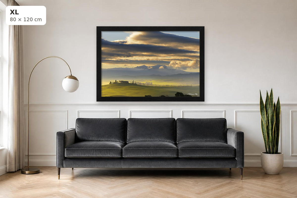 Dawn in Val d’Orcia, a photograph by Duccio Nacci framed above a sofa
