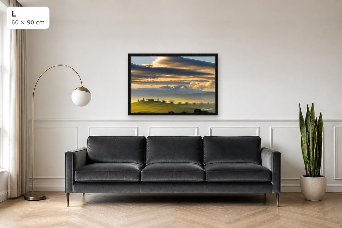 Dawn in Val d’Orcia – fine art print by Duccio Nacci, size L with thin black frame shown above a sofa