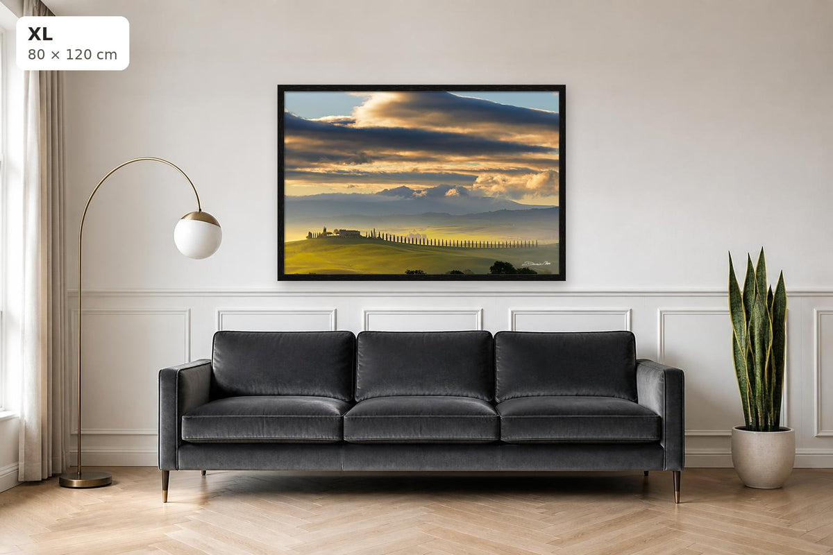 Dawn in Val d’Orcia – fine art print by Duccio Nacci, size XL with thin black frame shown above a sofa