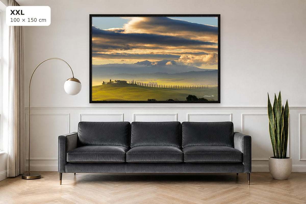Dawn in Val d’Orcia – fine art print by Duccio Nacci, size XXL with thin black frame shown above a sofa