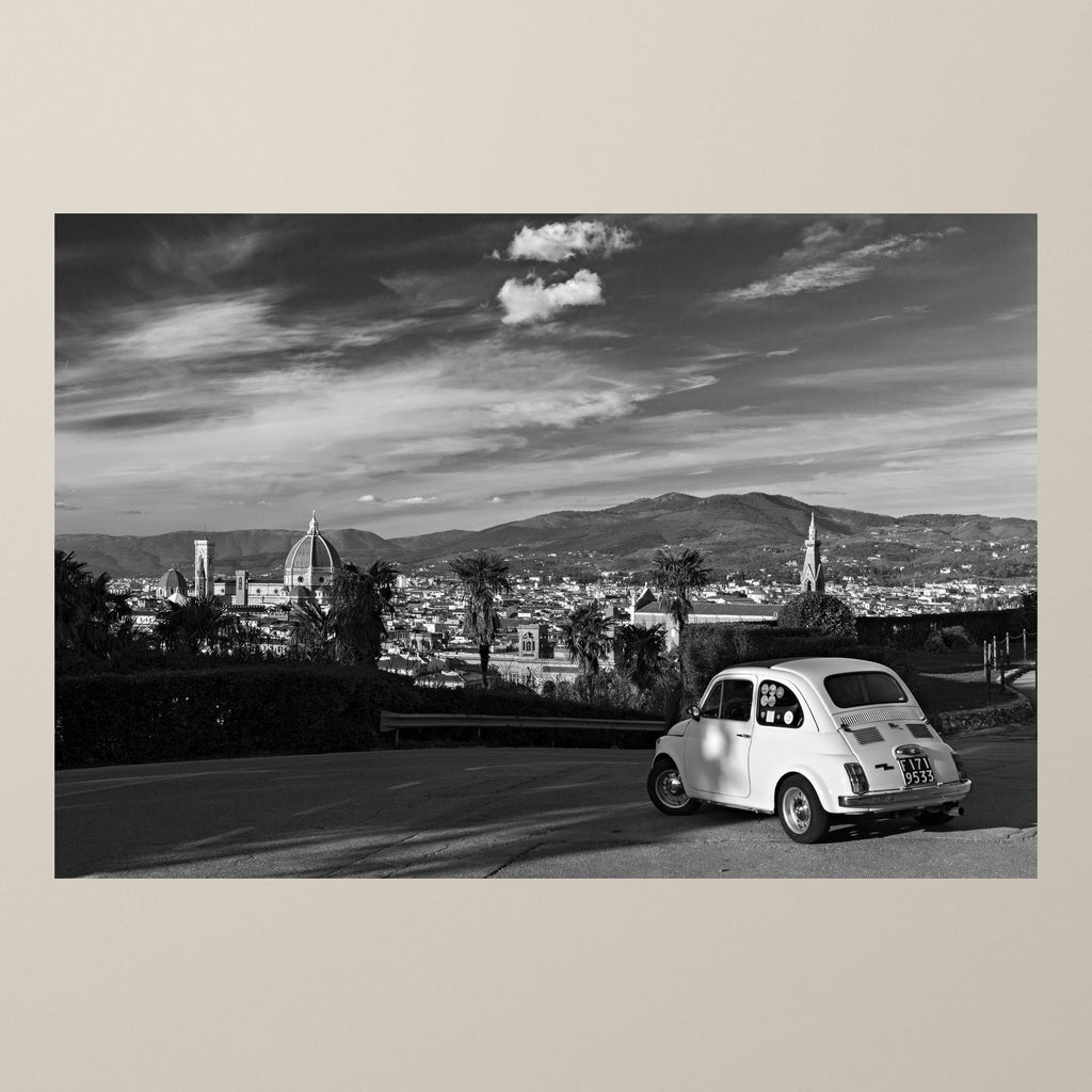 Florentine Dream – A white Fiat 500 at Piazzale Michelangelo with the dome of Florence Cathedral – photograph by Duccio Nacci