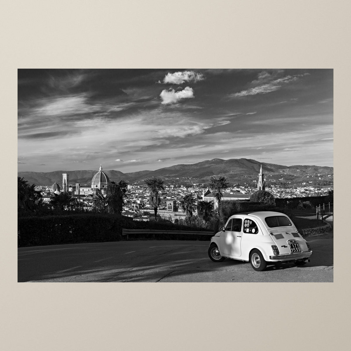 Florentine Dream – A white Fiat 500 at Piazzale Michelangelo with the dome of Florence Cathedral – photograph by Duccio Nacci