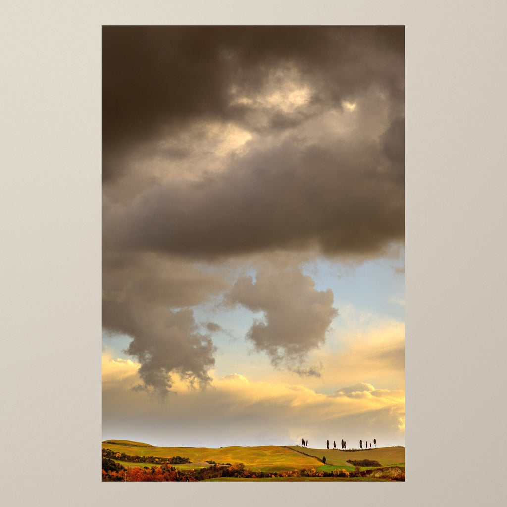 Golden Hills – Peach and amber sky over the hills of Volterra, with a row of cypresses – photograph by Duccio Nacci