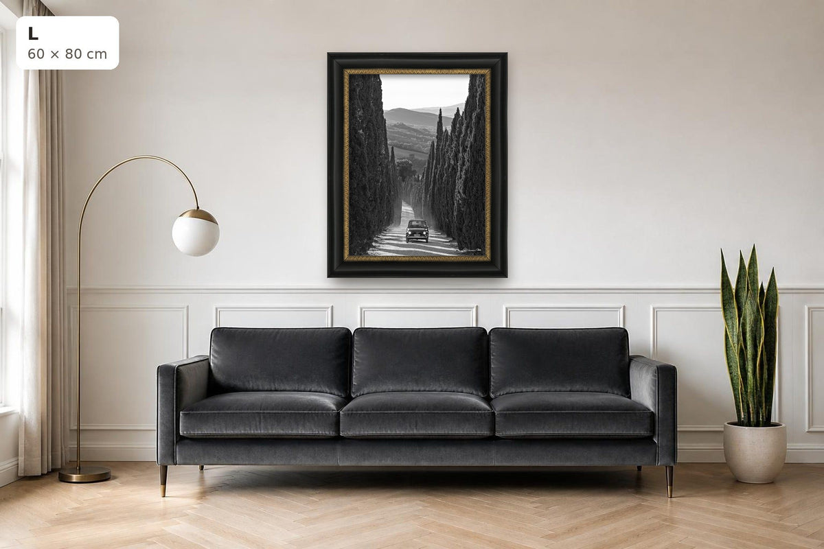 La Dolce Vita – fine art print by Duccio Nacci, size L with black and gold frame shown above a sofa