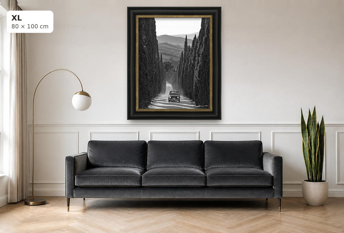 La Dolce Vita – fine art print by Duccio Nacci, size XL with black and gold frame shown above a sofa