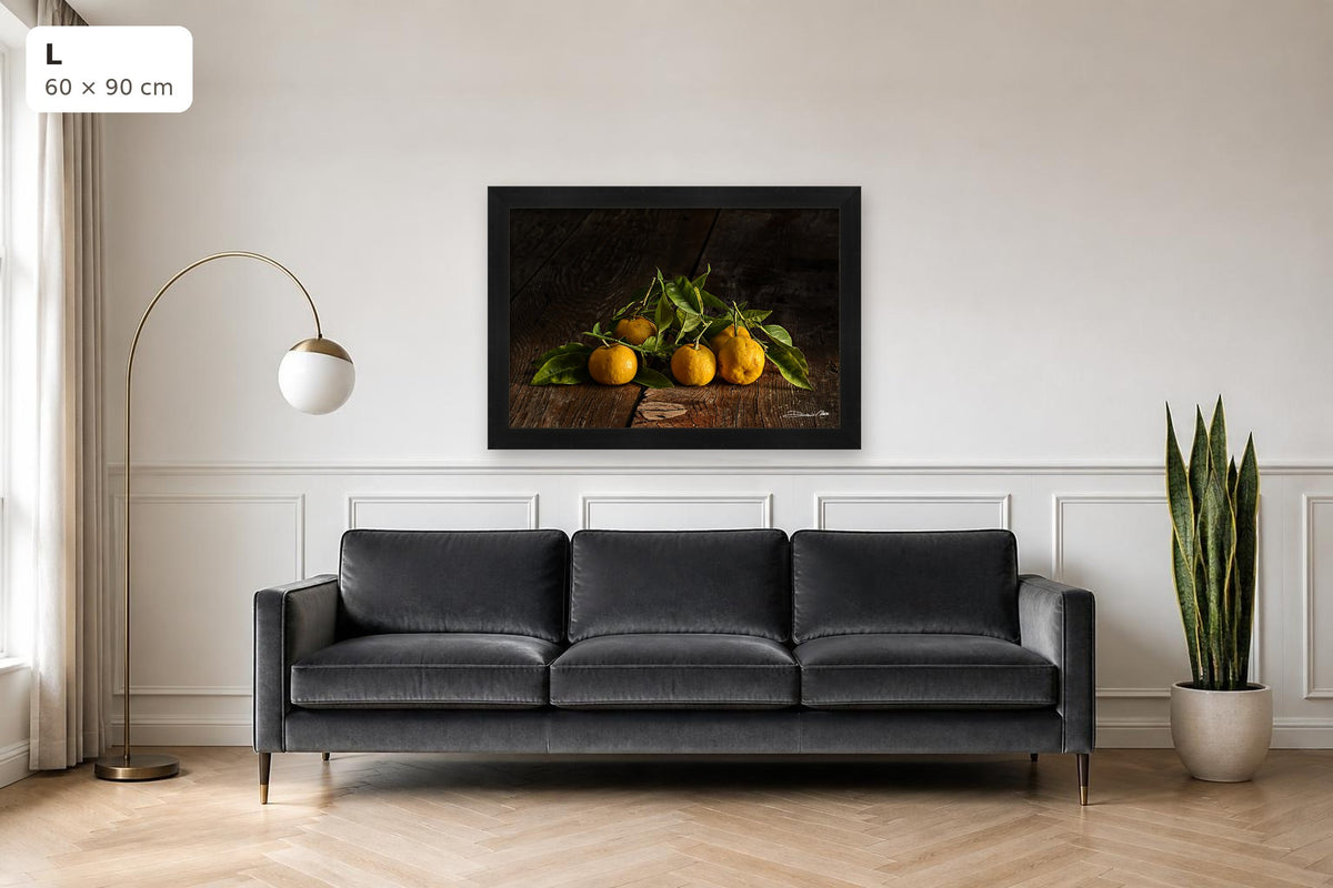 Tangerines – fine art print by Duccio Nacci, size L shown above a sofa