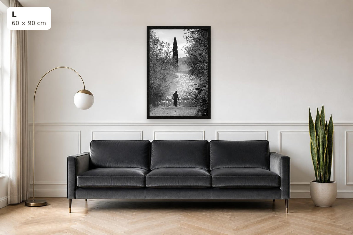 The Flock's Way – fine art print by Duccio Nacci, size L with thin black frame shown above a sofa