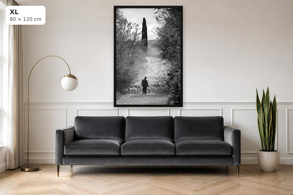 The Flock's Way – fine art print by Duccio Nacci, size XL with thin black frame shown above a sofa