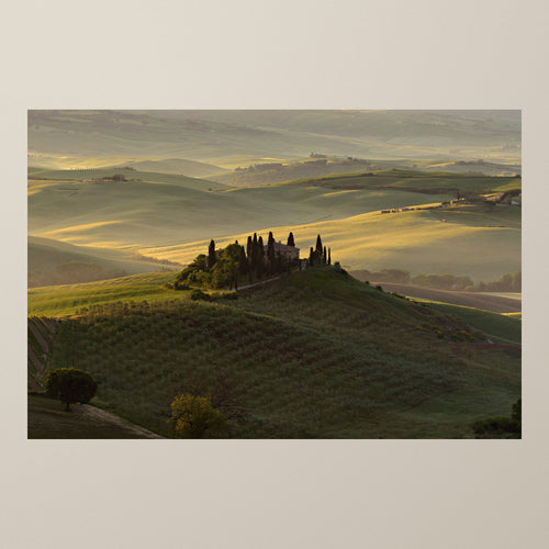 The Suspended Landscape – Dawn light over the Val d'Orcia hills and a villa among ancient cypresses – photograph by Duccio Nacci