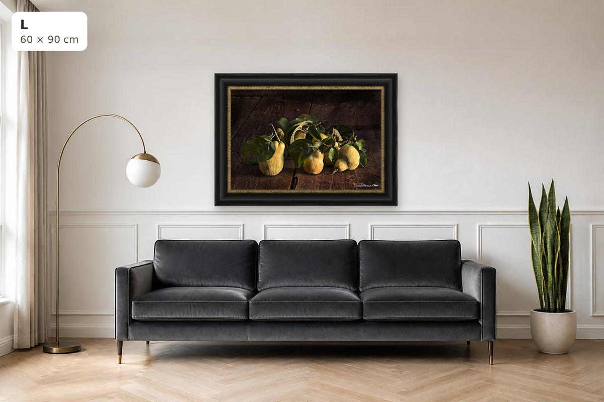 Time of the Quince – fine art print by Duccio Nacci, size L with black and gold frame shown above a sofa