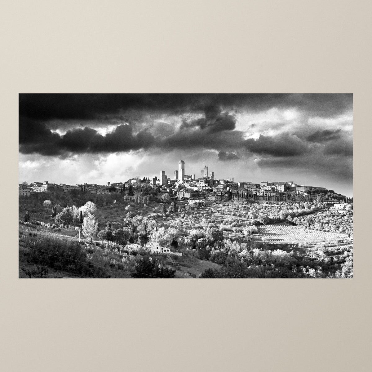 Timeless Towers – The towers of San Gimignano against a dramatic sky above the Tuscan hills – photograph by Duccio Nacci