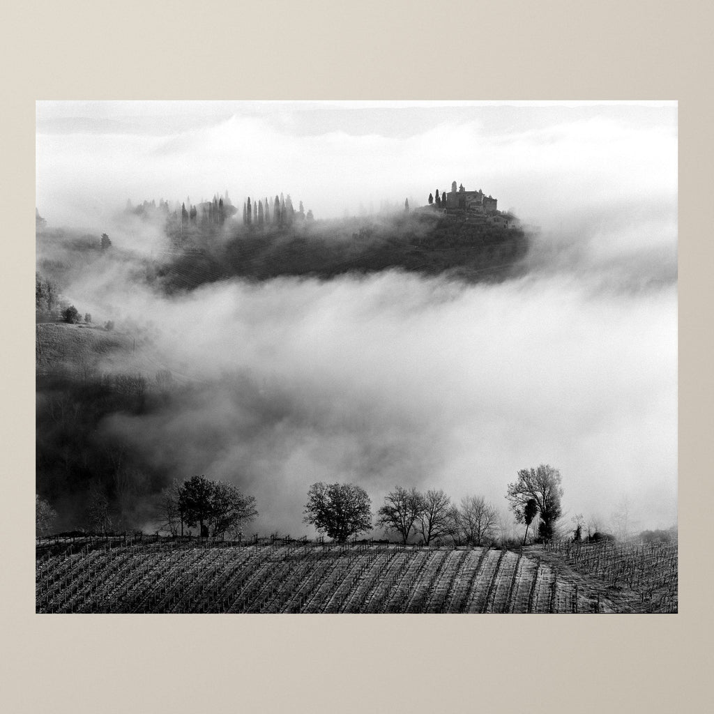 Whispers in the Mist – A villa crowned with cypresses rising from a sea of morning fog in the Tuscan hills – photograph by Duccio Nacci